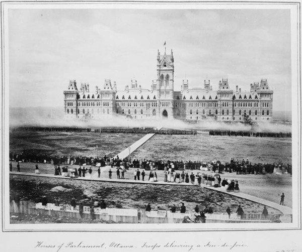 Original title:  MIKAN 3362203 Houses of Parliament, Ottawa. Troops delivering a Feu-de-Joie. 1868 [103 KB, 760 X 636]